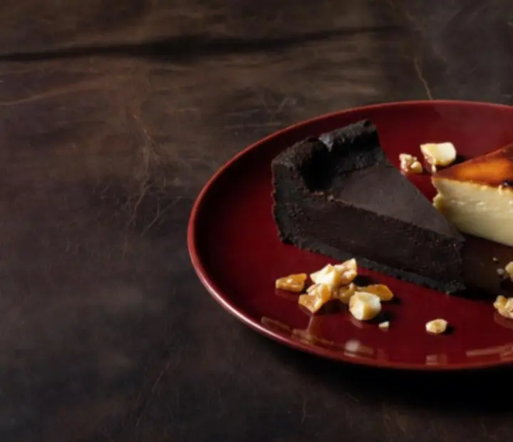 Refined Australian dessert trio on a dark plate