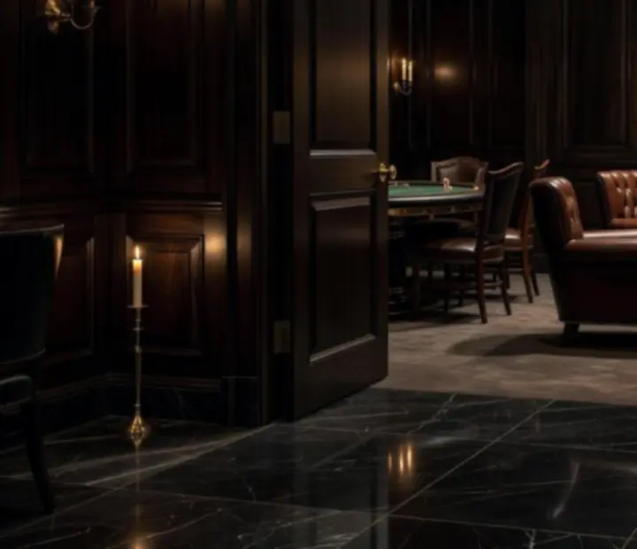 Matte-black marble entrance to a black tie poker salon with candlelight and leather seating.