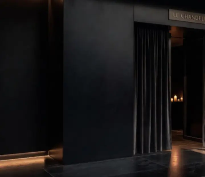 Velvet-draped black-tie entrance to an Australian restaurant at night